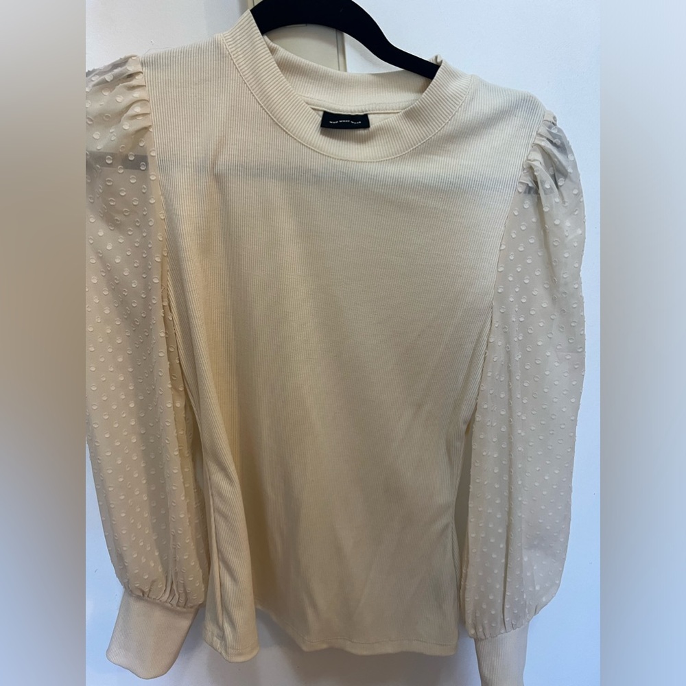"We wore what" long sleeve top polka dot sleeves